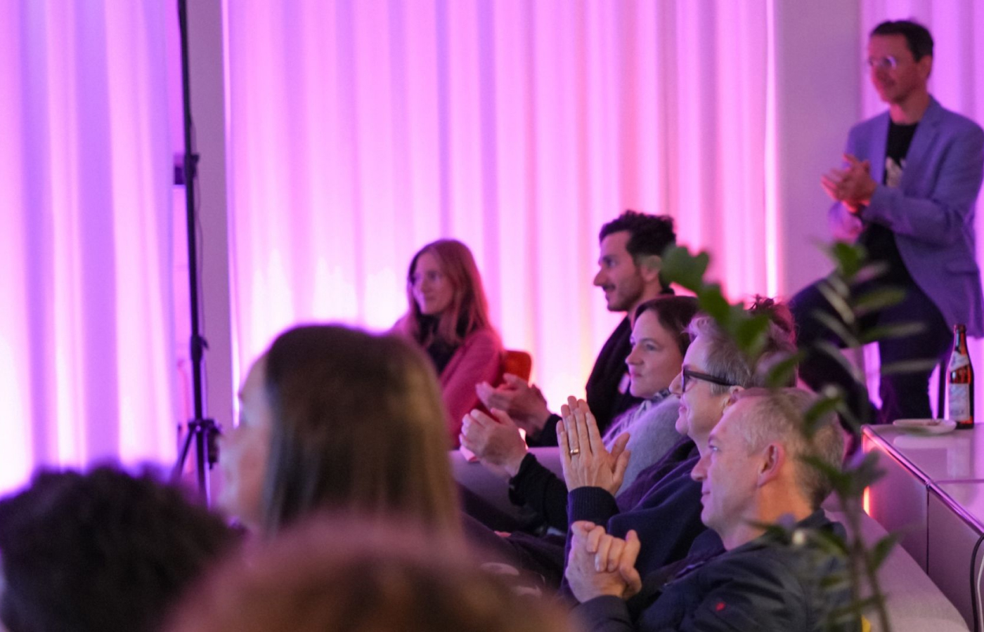 Audience clapping at a past PUSH UX fringe event.