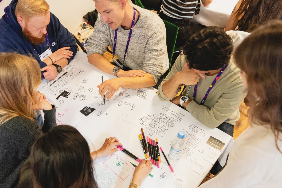 Participants sketching together during a breakout session